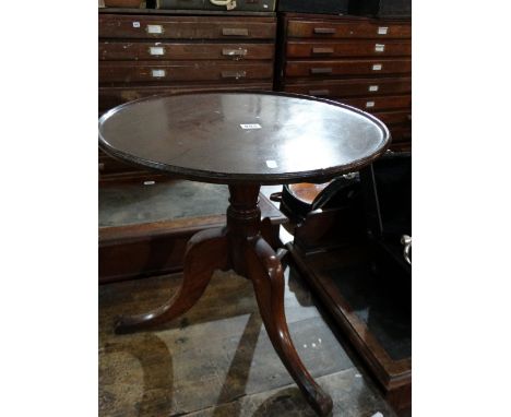 A Circular Topped Mahogany Occasional Table On A Tripod Base