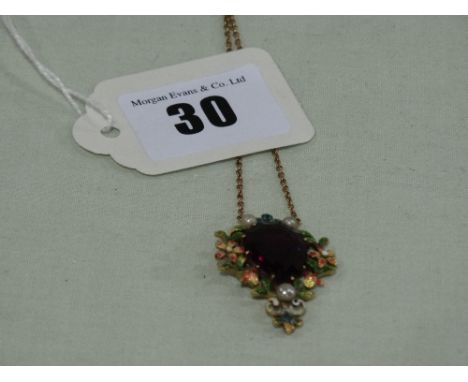 A High Carat Gold Art Nouveau Period Pendant, The Front Decorated With An Enamel Floral Border Surrounding A Centre Amethyst 
