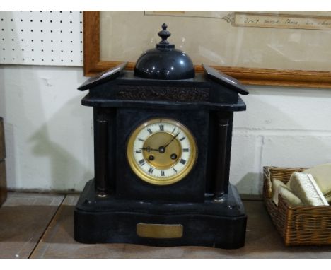 A Victorian Black Marble Encased Mantel Clock With Circular White Enamel Dial