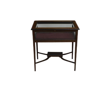 An Edwardian crossbanded inlaid mahogany vitrine the crossbanded top with ebony and boxwood inlay and bevelled glass, opening