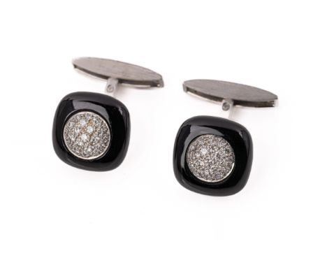 A pair of 18ct. white gold, enamel and diamond cufflinks The cufflinks set with brilliant-cut diamonds to a black enamel surr