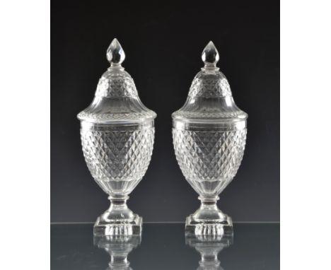 A good pair of early 19th century Voneche cut glass urn shaped jars and covers lemon squeezer base, pointed pineapple finial,