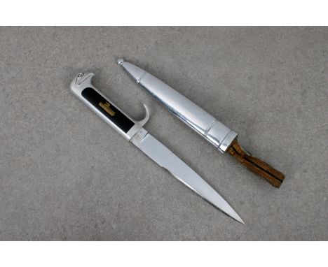 An Italian MVSN (Opera Balilla) officer's dagger aluminium hilt, equipped with inlaid black celluloid and the obverse with in