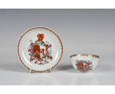 A Chinese armorial tea bowl and saucer c.1745, painted with the arms of Fearon impaling Eckford of Sussex, within a gilt spea