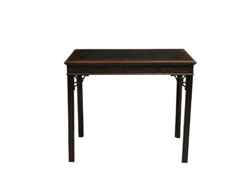 A Chippendale style mahogany side table with a cross banded top and leather insert, a blind fret carved frieze on four shaped