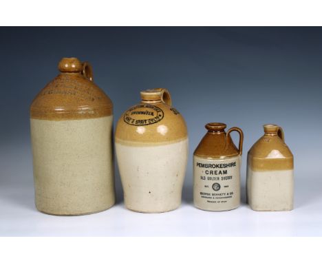 A small collection of stoneware flagons to include a W. J. Armstrong, Wine, Spirit &amp; Beer Merchant, East Grinstead flagon