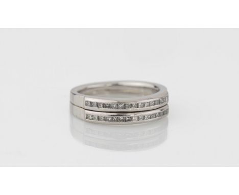 A Catherine Best platinum and diamond two row half eternity ring channel set with princess cut diamonds, total weight 0.90ct,