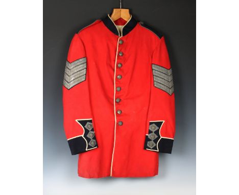 A Guernsey Militia scarlet tunic possibly Sergeant Major, West regiment, eight silvered buttons to front bearing crowned lion