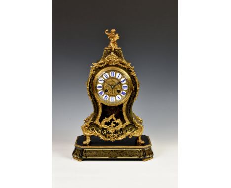 A French Boulle inlaid striking mantel clock late 19th century, the balloon shaped case with gilt metal foliate scroll, husk,