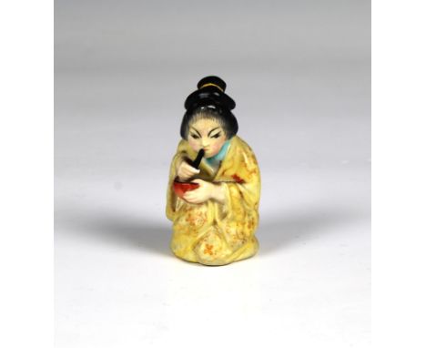 A Royal Worcester figural candle snuffer fashioned as a Japanese Geisha girl, puce mark, 2¾in. (7cm.) high. * Good condition,