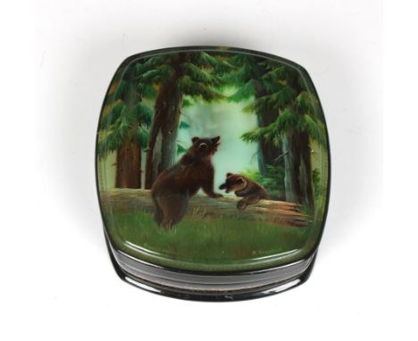 A mid to late 20th century Russian lacquered box of rounded oval form, the hinged cover showing a bear and cub in a forest se