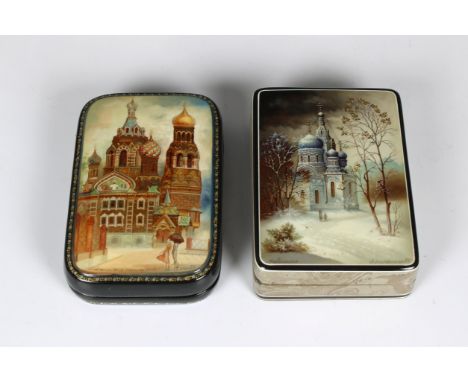 Two mid to late 20th century Russian lacquered boxes the first Fedoskino version of rectangular form, the hinged cover depict
