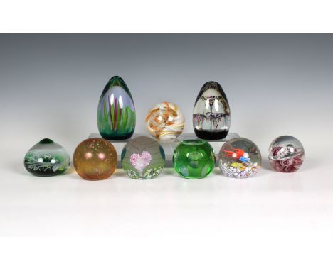 A collection of Caithness Glass paperweights to include a teardrop form weight 'Forest Flame' with certificate, No. 0048; gre