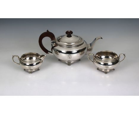 A George V silver three piece tea service Martin Hall &amp; Co, Sheffield, 1927, of compressed spherical form, chased borders