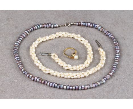 An 18ct gold and single pearl twist ring size K; together with two freshwater pearl necklaces. (3)