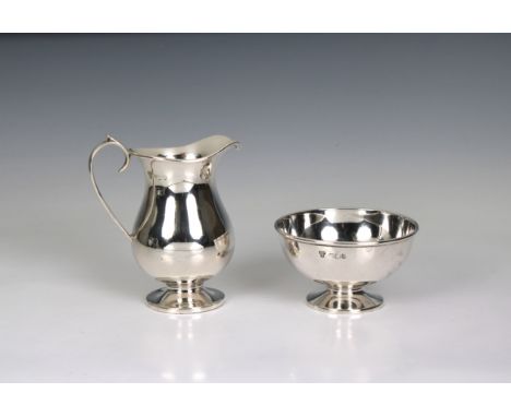 An Elizabeth II silver jug Harrods Ltd, Sheffield, 1963, of baluster form, 4¾in. (12.2cm.) high, together with a matching bas