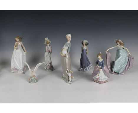 A collection of boxed Lladro figurines to include 866 Girl with puppy and goose; 7636 Girl with umbrella; 5662 May Dance; 566