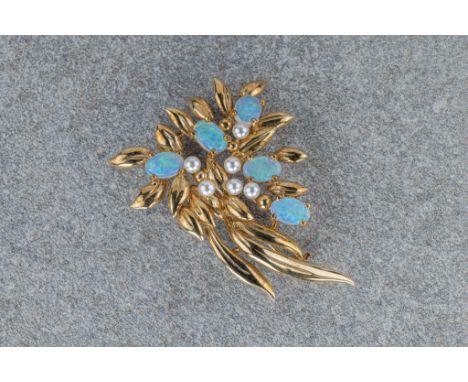 A 9ct gold, water opal and seed pearl spray brooch 42mm. long.