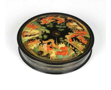 A mid to late 20th century Russian lacquered box of circular form, the pull off cover exquisitely detailed, depicting a figur
