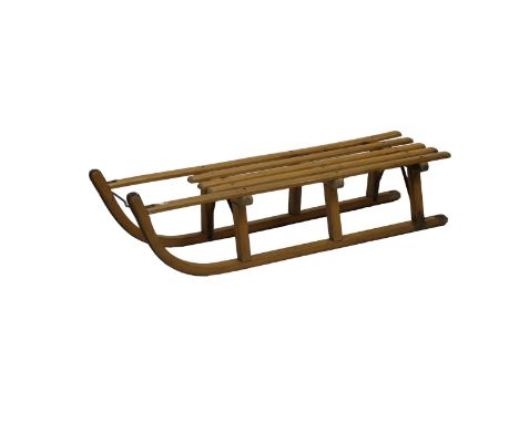 A vintage Davos-suner wooden toboggan/sled 43½in. (110.6cm.) long