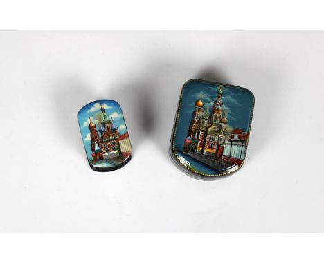 Two mid to late 20th century Russian lacquered box both of oval form, the hinged cover depicting temples / churches, iridesce
