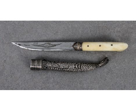 A small Turkish Bichaq type knife 10.8cm. single edged blade, later engraved with foliate design and Xaria 1937, grip with bo