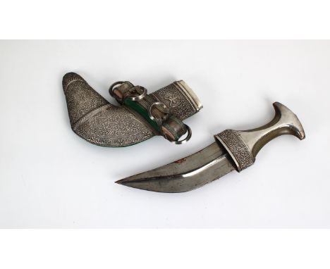 An early 20th century Omani Khanjar dagger bearing the arms of the Sultanate of Oman steel blade, waisted horn hilt with silv