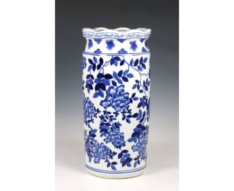A Chinese blue and white stick stand painted with flowering boughs and a floral band around the neck, 18 inches high (46cm) *