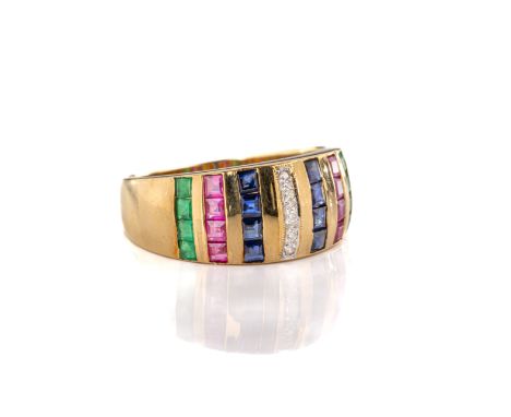 An 18ct yellow gold diamond, ruby, sapphire and emerald ring. The central band of brilliant-cut diamonds flanked either side 