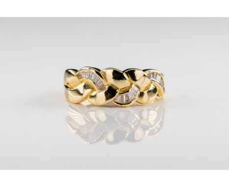 An 18ct yellow gold diamond dress ring the ring of woven design, one strand set with tapered baguette cut diamonds, ring size