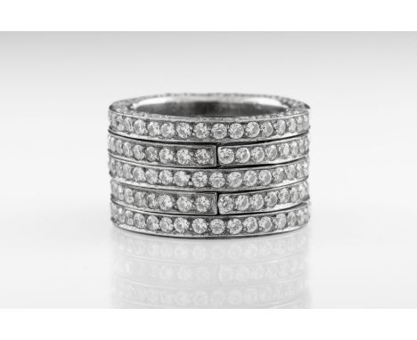 An 18ct white gold and diamond metamorphic eternity ring The intersecting five rows set with brilliant-cut diamonds to the ch