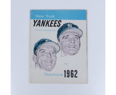The official World Champion Yankees yearbook showcases the full roster of players, highlighting their talents and achievement