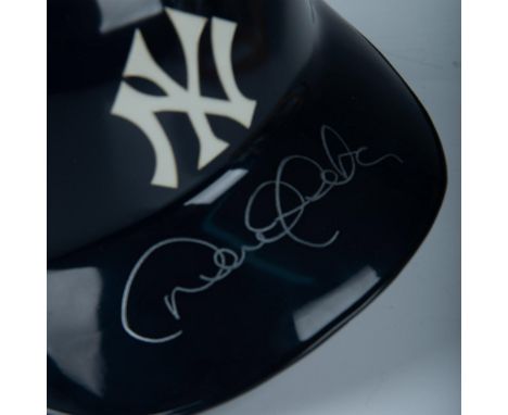 This is an authentic Diamond Collection MLB helmet with NY Yankees logo and signed in silver on the brim by Hall of Famer Der