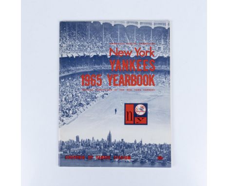 The official Yankees yearbook showcases the full roster of players, highlighting their talents and achievements. It features 