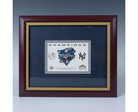 This framed collectible features an embroidered patch commemorating the 2000 World Series Champions the NY Yankees. Sight Siz