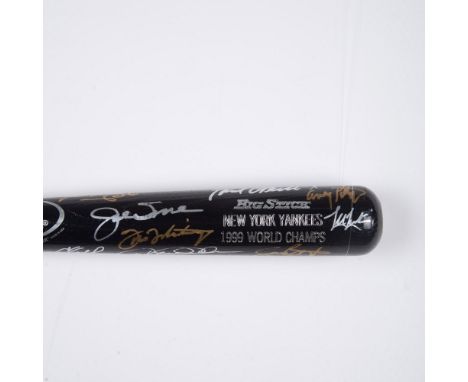A black and silver Rawlings Big Stick bat signed in gold and silver Sharpie by 19 members of the 1999 New York Yankees World 