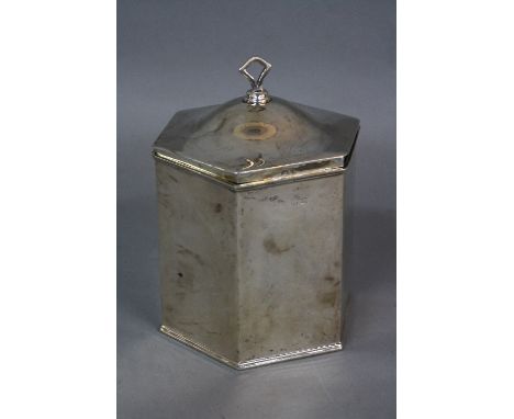 A GEORGE V HEXAGONAL SILVER TEA CADDY, domed hinged cover with flattened lozenge shaped finial, marks partially rubbed, Birmi