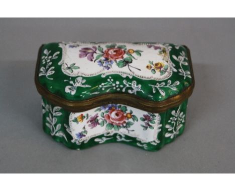 A LATE 18TH CENTURY ENAMEL DESK SET, of serpentine outline, green ground heightened with white sprigs and insects, the top wi