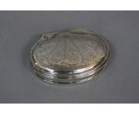 A LATE GEORGIAN CONTINENTAL WHITE METAL SNUFF BOX, of scallop shell design, foliate engraved hinged cover, worn gilt interior