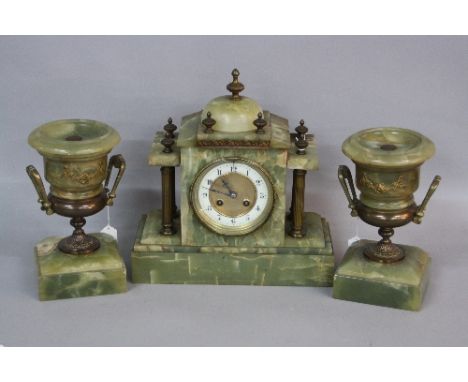 A LATE 19TH CENTURY ONYX CLOCK GARNITURE, comprising mantel clock of architechural form with gilt metal finials and columns, 