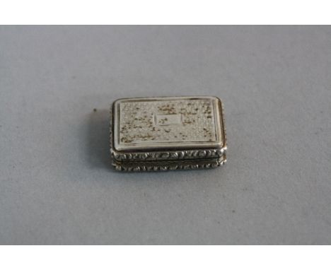 A WILLIAM IV SILVER VINAIGRETTE, of rectangular form, cast rims, engine turned decoration, blind cartouche, gilt interior, ma