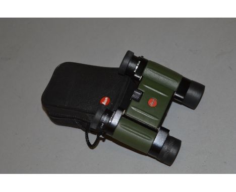 A PAIR OF LEICA 8 X 20 BINOCULARS, the lenses are stamped with 8 x 20 BCA, Leica camera, Trinovid and Serial No.1378811, come