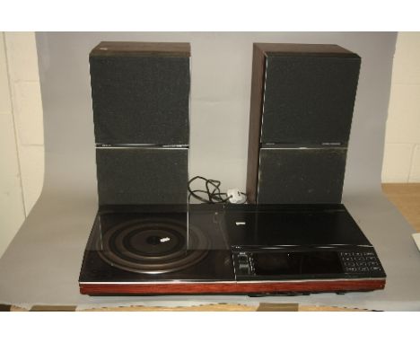 A BOXED BANG & OLUFSEN BEOCENTRE 5000, and a pair of Beovox S55 speakers, the turntable is fitted with a MMC 20CL Stylus and 