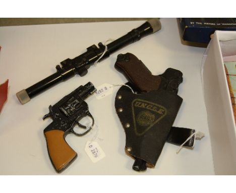 A LONE STAR 'MAN FROM U.N.C.L.E.' 9MM AUTOMATIC PISTOL IN HOLSTER, missing silencer, cap gun works ok but has some wear and p