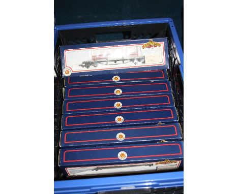 A QUANTITY OF BOXED BACHMANN OO GAUGE ROLLING STOCK, assorted Bogie Bolster & Bogie Well Wagons, assorted companies, loads an