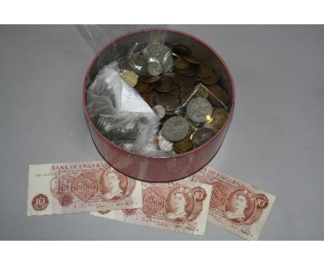 A TIN CONTAINING BRITISH COINS, to include  a good grade 1930 half crown better than V/F, .500 silver other coins, three ten 