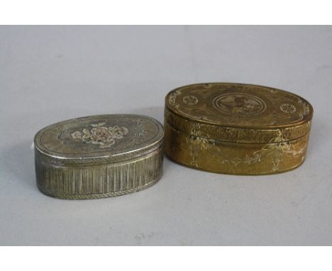 A FRENCH WHITE METAL AND GILT OVAL SNUFF BOX, hinged cover chased with a floral spray with radiating cartouche border, the ba