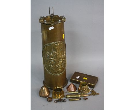 A BOX CONTAINING A LARGE WWII ERA SHELL CASING FASHIONED INTO A CIGARETTE ASHTRAY, with match holder centre, a large scene of