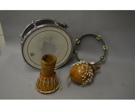 A SELECTION OF PERCUSSION INSTRUMENTS, including a 14'' snare drum (no name), a vintage tambourine and two African instrument