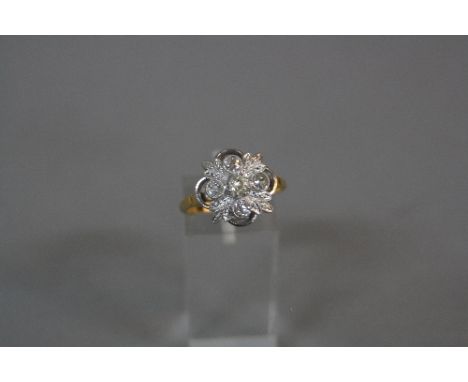 A DIAMOND DRESS RING, foliate open work design, total old Swiss cut diamond weight estimated 0.60ct, colour assessed as K-tin